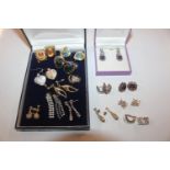 A box containing various costume ear-rings