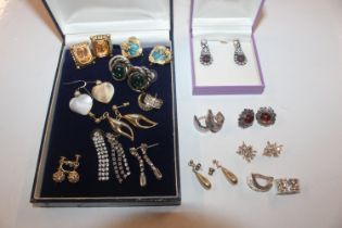 A box containing various costume ear-rings