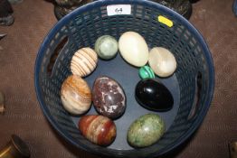 A basket of ten onyx and glass eggs
