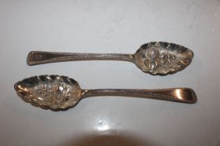 Two silver berry spoons