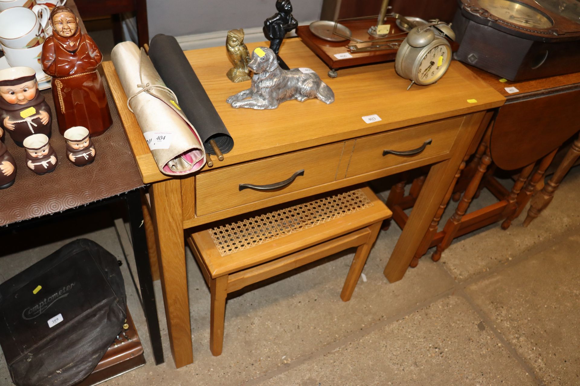 A light oak hall table fitted single drawer and a cane seated dressing table stool