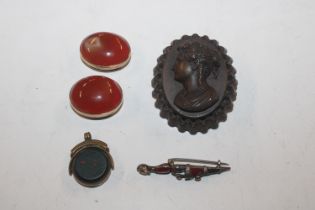 A portrait brooch; a brooch in the form of a dagge