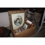 A box of various paintings, needlework, a pair of
