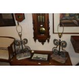 A pair of table lamps decorated with eagle heads,