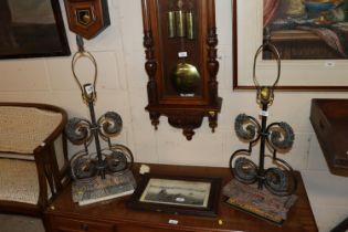 A pair of table lamps decorated with eagle heads,