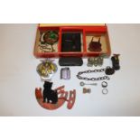 A cigar box and contents to include AA badge, bras