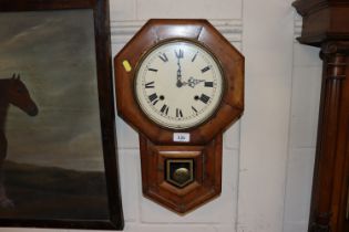 A walnut cased 8 day movement wall clock