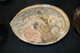 A porcelain dish in the form of a large shell deco