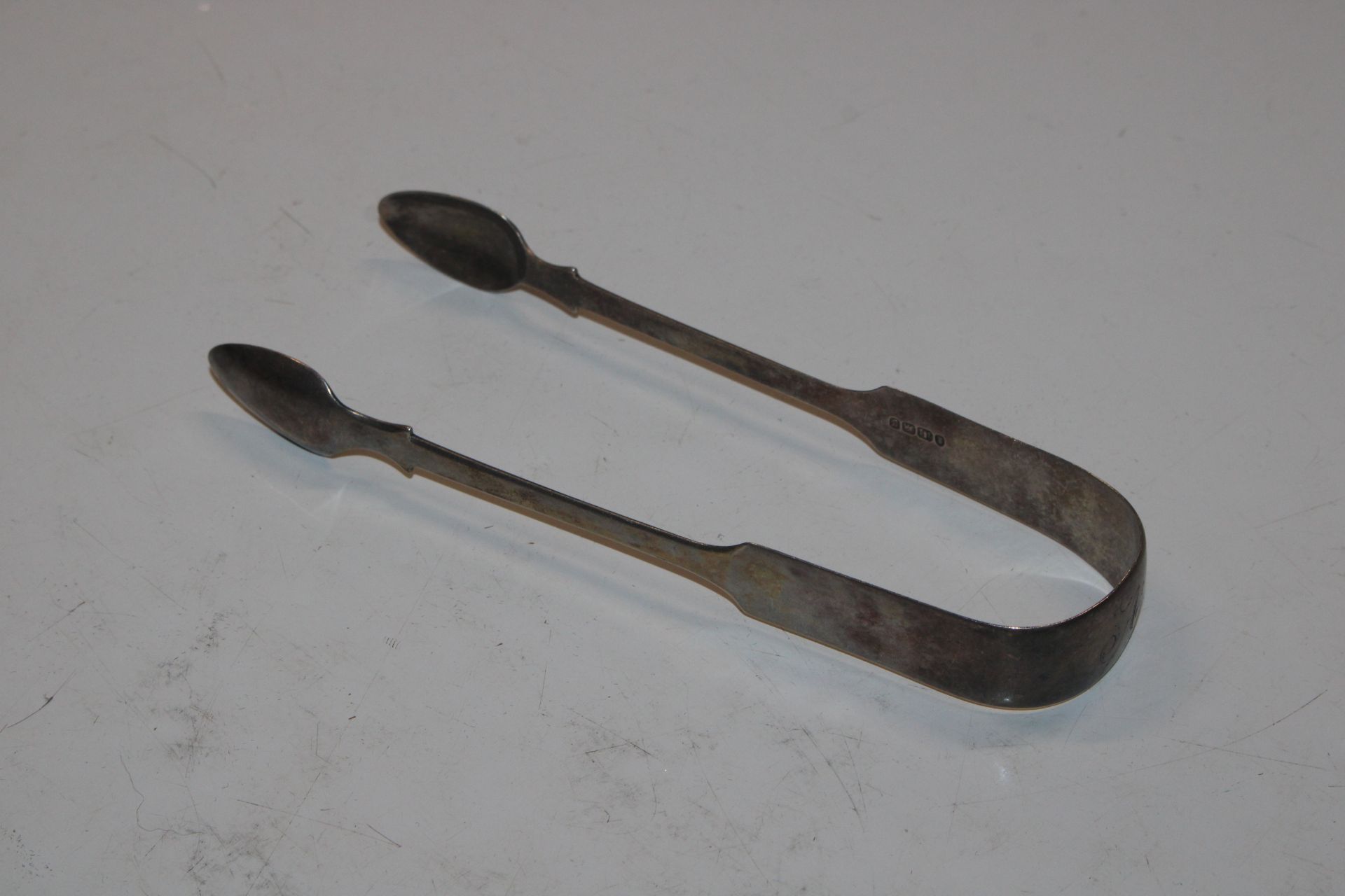 A pair of silver sugar tongs and a set of four sil - Image 2 of 19