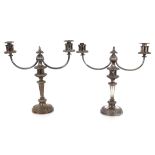 A pair of plated on copper twin branch candelabra