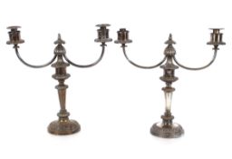 A pair of plated on copper twin branch candelabra