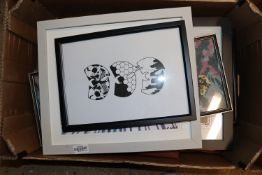 A box of various pictures and prints