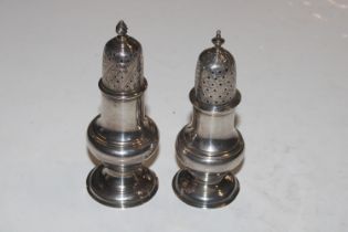 Two silver pepperettes, approx. total weight 135gm