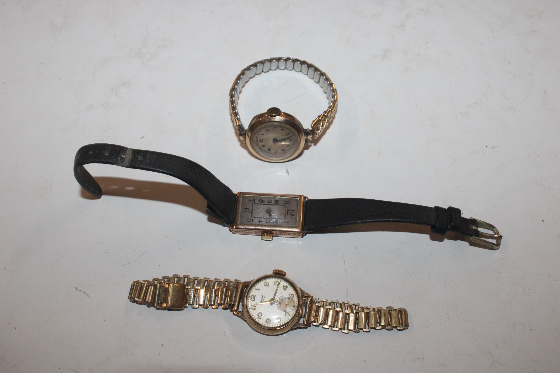 Three 9ct gold cased wrist watches