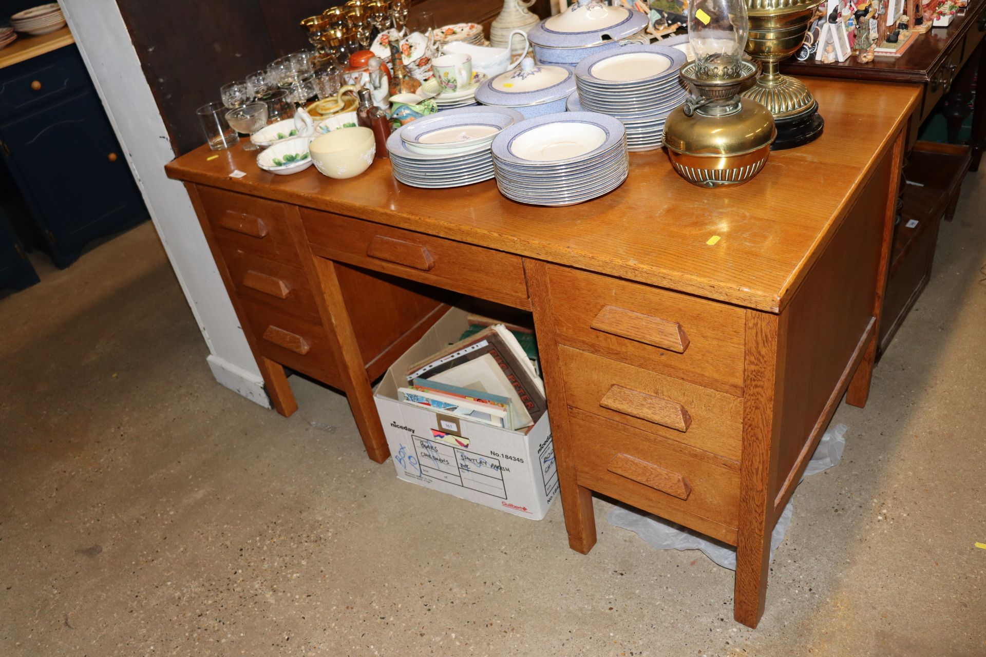 An oak desk fitted seven drawers