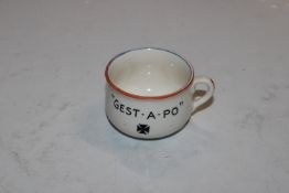 A novelty ashtray in the form of a chamber pot, "F