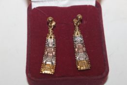 A pair of silver gilt ear-rings