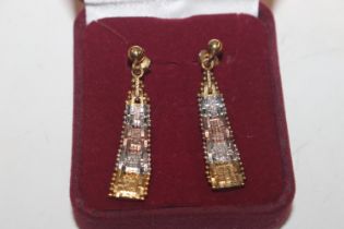 A pair of silver gilt ear-rings