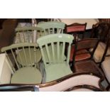 A pair of green painted spindle back chairs; a pai