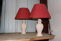 A pair of St Michael table lamps with red shades