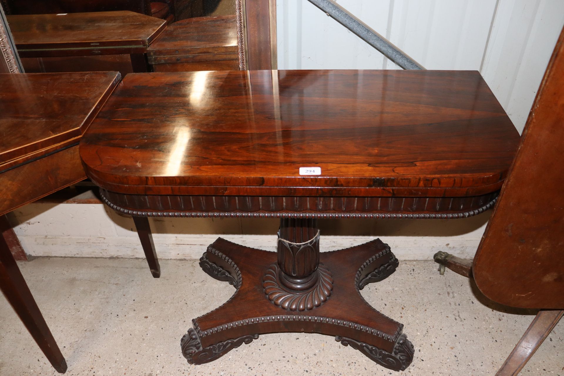 A 19th Century rosewood card table, the fold over