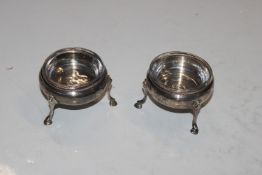 A pair of silver salts with glass liners, approx t