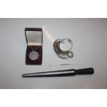 A ring measuring kit; and a reproduction pewter me