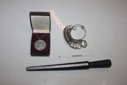 A ring measuring kit; and a reproduction pewter me