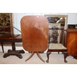An early 19th Century mahogany tilt top occasional