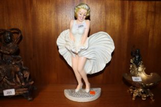 A cast iron door stop in the form of Marilyn Monro