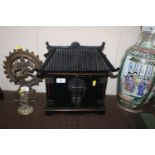 An Oriental lacquered pagoda shaped table top trin