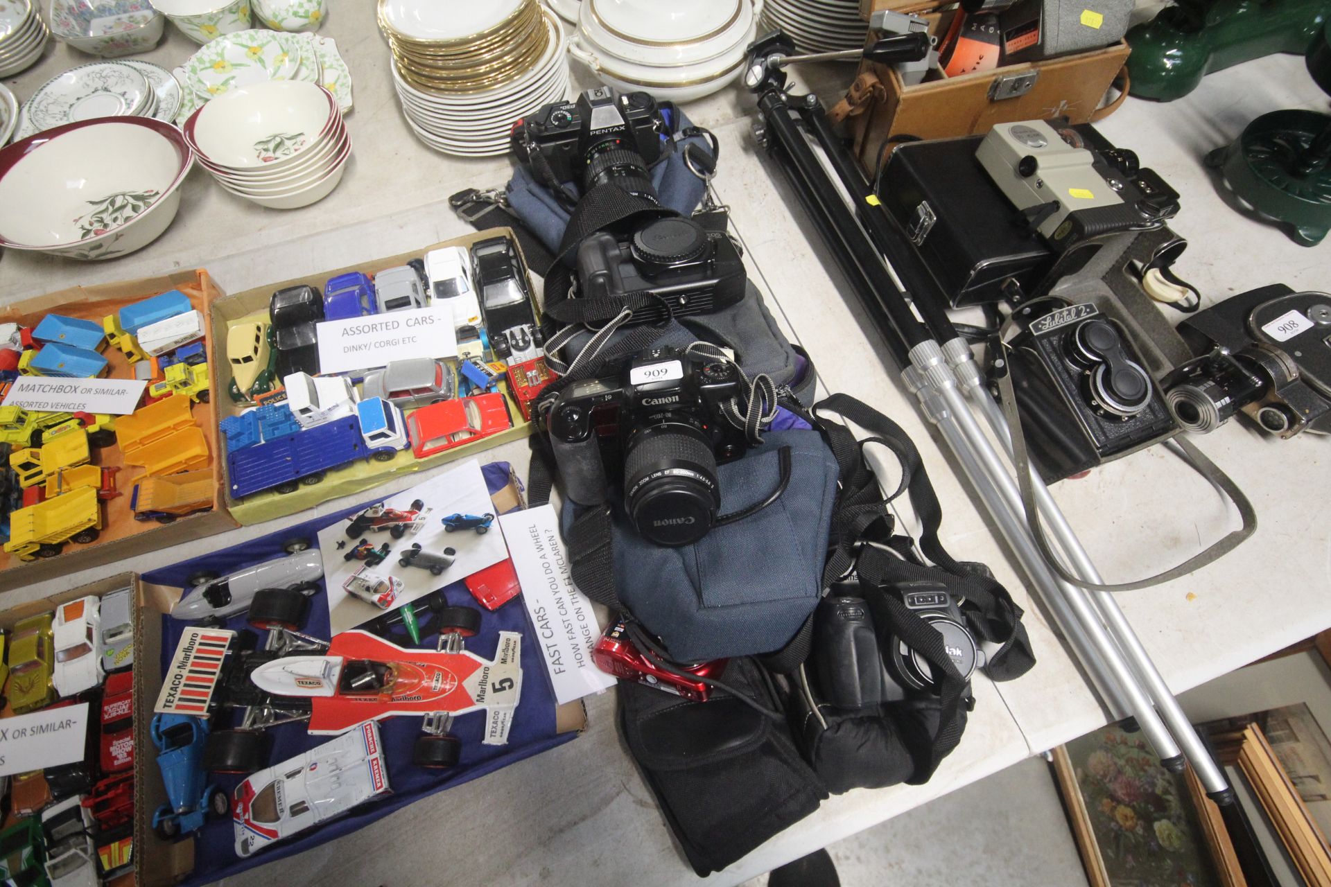 A collection of cameras to include Canon and Penta