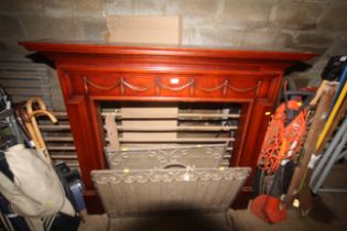 An ornate wooden fire surround