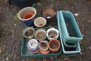 A quantity of various glazed and other plant pots,