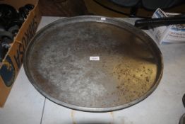 A circular metal tray measuring approx. 21.5" in d