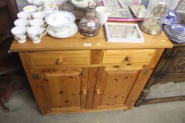 A stripped pine cabinet