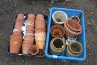 A quantity of various sized terracotta plant pots,