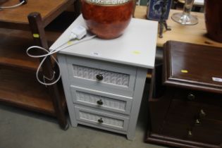 A painted wicker fronted three drawer bedside ches