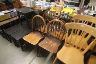 A set of four stick back kitchen chairs