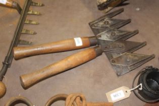 A set of wooden handled hedging shears with multi