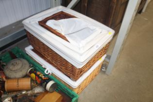 A graduated set of four wicker trays