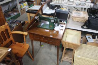 A Jones sewing machine on table base