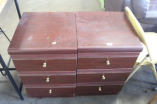 A pair of mahogany effect bedside chests each fitt