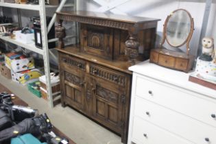 An oak reproduction court cupboard