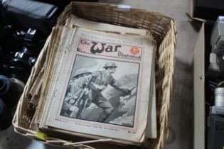 A wicker basket and contents of 'War Illustrated'