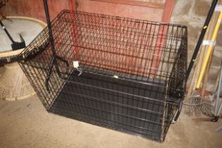 A large metal folding pet cage measuring 30" x 48" x 31"