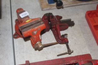 A 3.5" bench vice on rotating base together with a