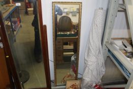 A gilt framed hall mirror