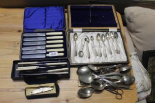 A quantity of various plated flatware consisting of tea knives, spoons etc.