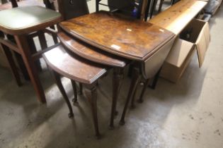 A nest three burr walnut coffee tables